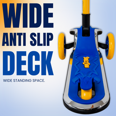 A blue and yellow children's kick scooter deck with yellow wheels and a silver metal frame, shown on a light blue gradient background with large text reading 'WIDE ANTI SLIP DECK' and 'WIDE STANDING SPACE.'.